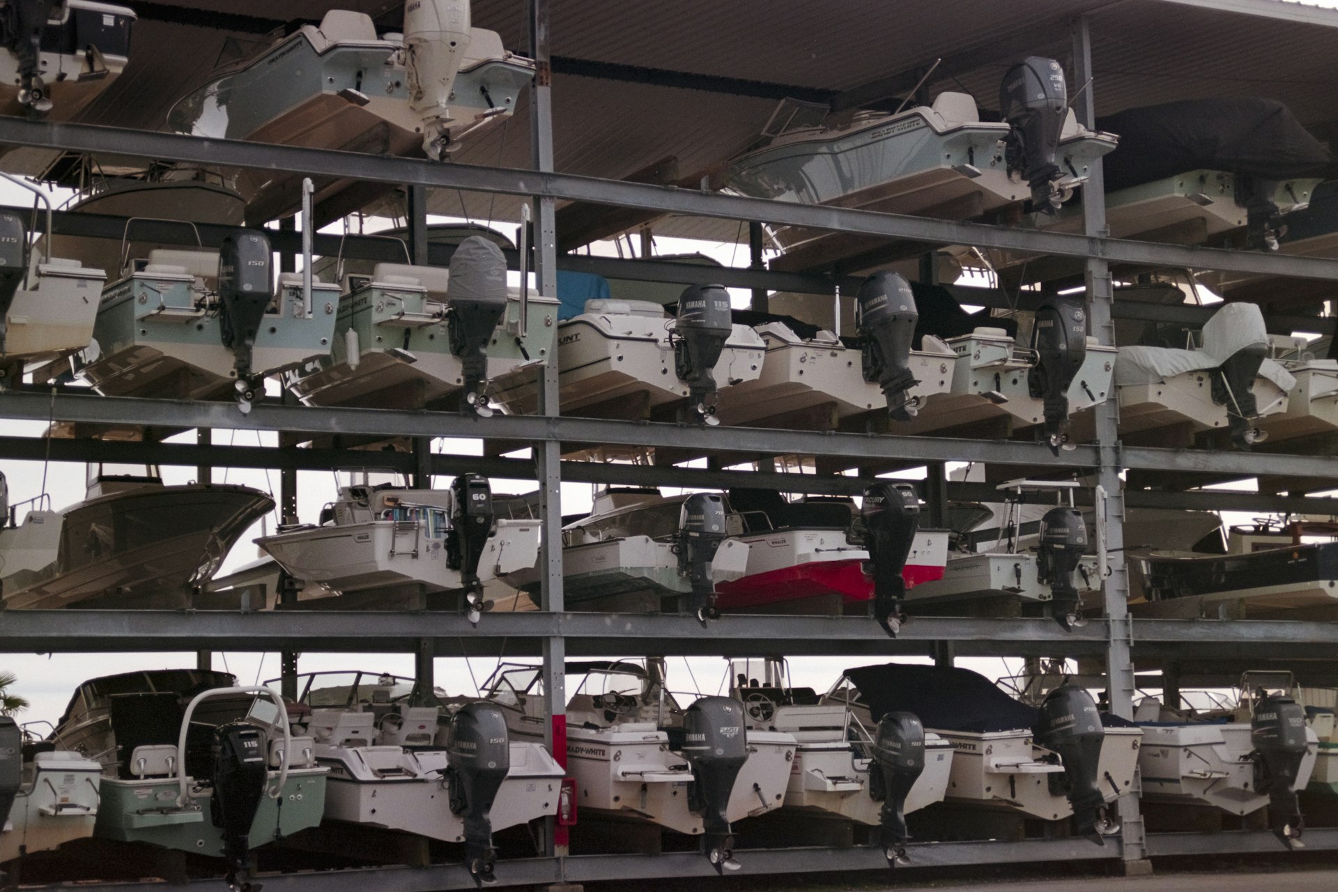 Boats stored on multi-level racks at a marina storage facility